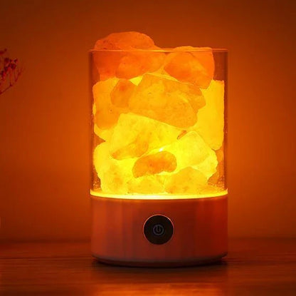 Himalayan salt lamp with warm, soothing glow and color-changing capabilities for air purification and relaxation