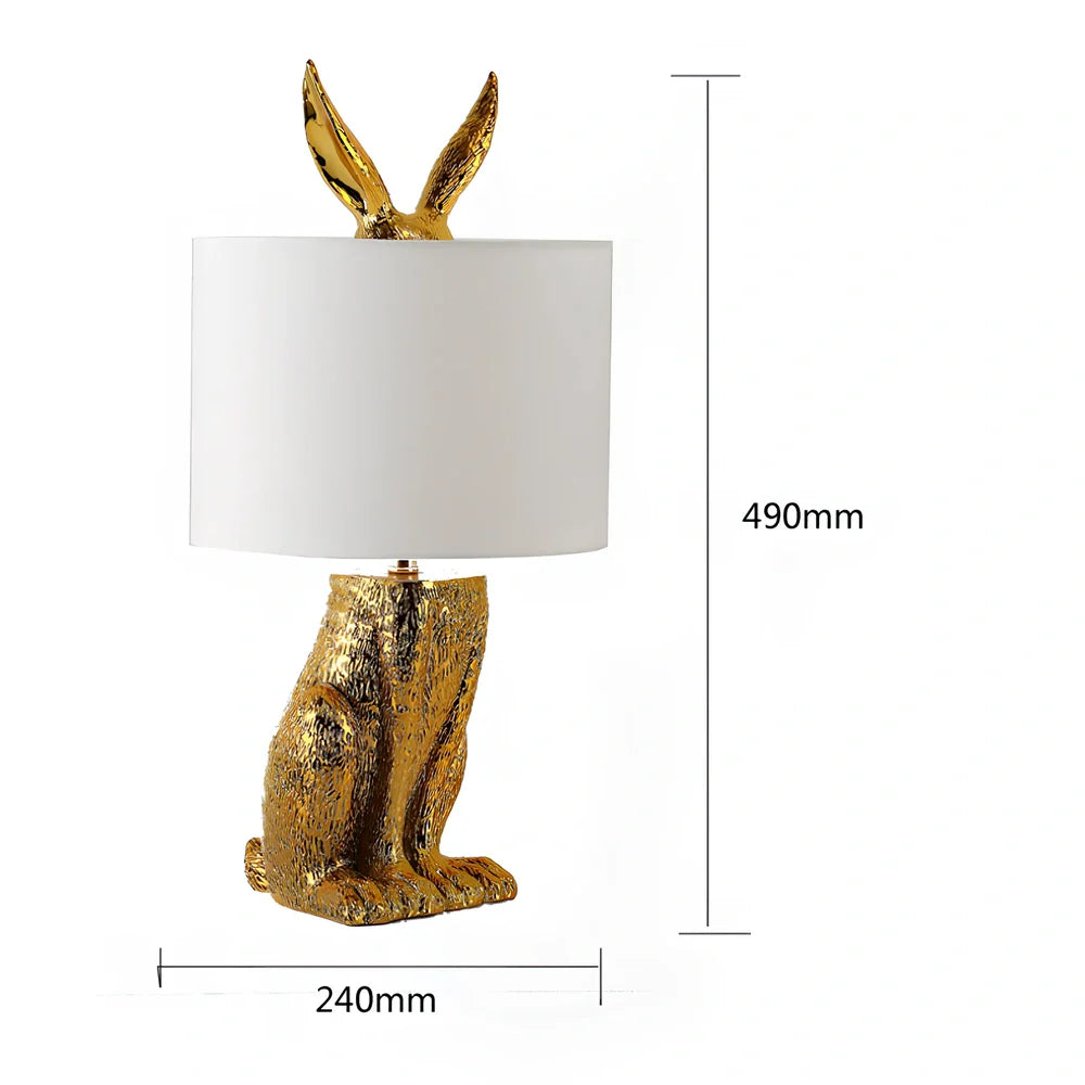 White rabbit table lamp with metal base and resin details, 24cm wide by 49cm high