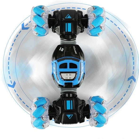 Red 4WD RC stunt car performing sideways drift with LED lights illuminated, showing gesture remote control