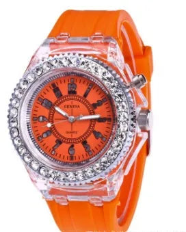 Women's LED luminous quartz watch with silicone strap and round alloy case on wrist