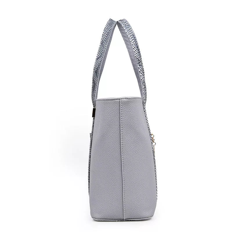 Women's stylish shoulder bag with zipper closure and multiple pockets in light gray, black, off-white, and rose red.