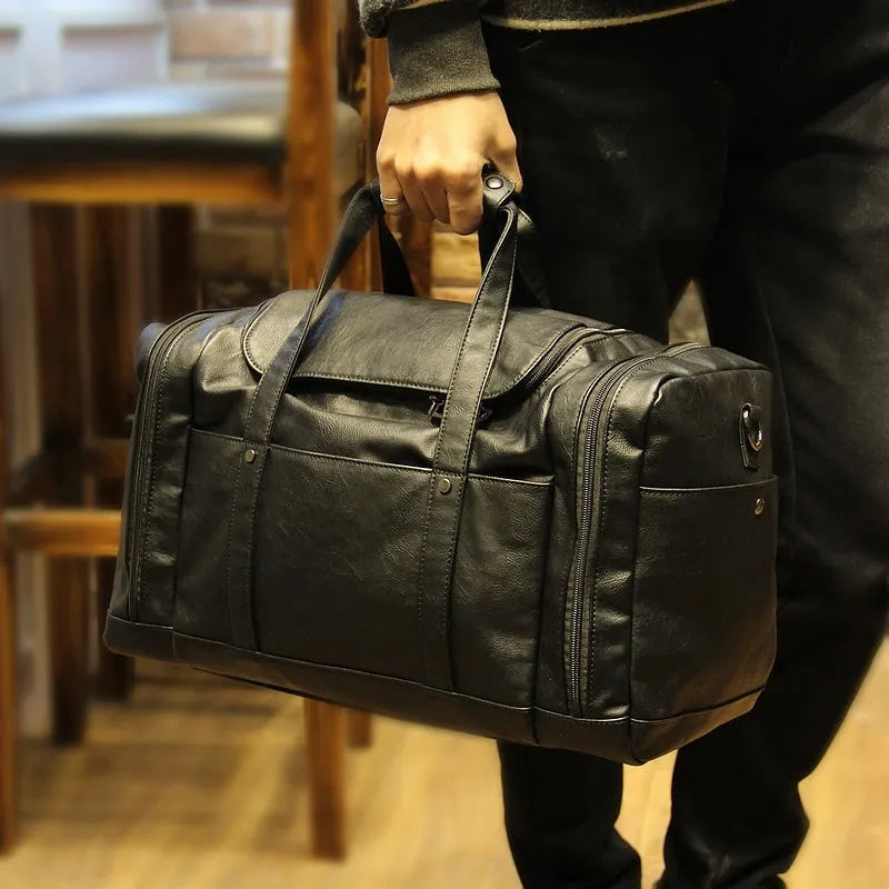 Black PU men's travel bag, 50cm wide and 26cm high, with phone, cigarette, and hidden zipper bags
