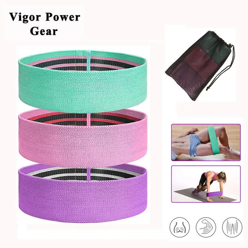 Squat resistance band hip ring in pink, purple, and green for lower body workouts