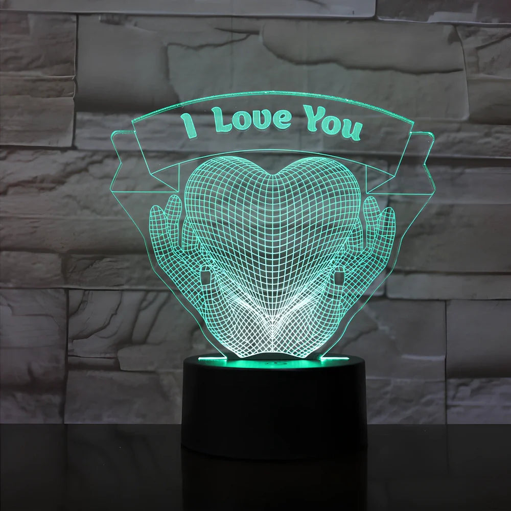 3D acrylic night light with hands holding heart design, showing seven colour options and remote control