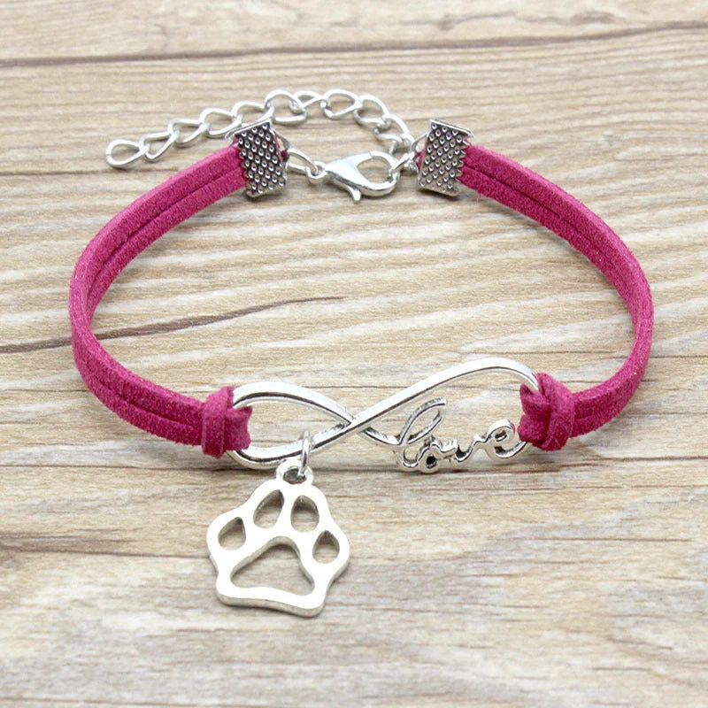 Hand-woven Infinite Love Pet Bracelet in various colors, showcasing the bow shape and alloy material.