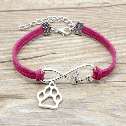 Hand-woven Infinite Love Pet Bracelet in various colors, showcasing the bow shape and alloy material.