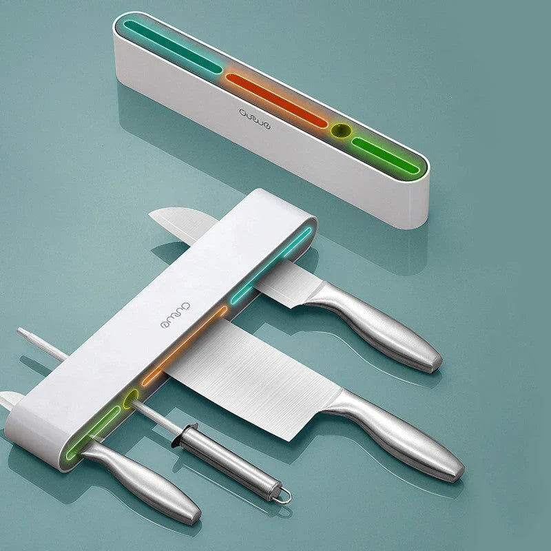 Sleek wall-mounted knife organizer with slots for knives and hooks for storing kitchen essentials