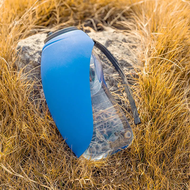 Portable pet water bottle with drinking bowl in blue, showing 680ml capacity and key lock mechanism
