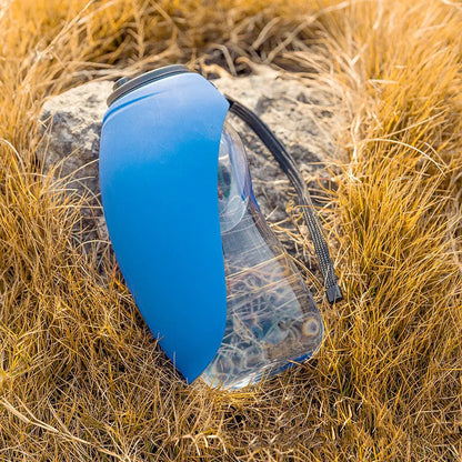 Portable pet water bottle with drinking bowl in blue, showing 680ml capacity and key lock mechanism