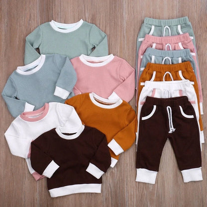 Girls' linen jacket and trousers set in brown, green, pink, or white, sizes 6M to 4T
