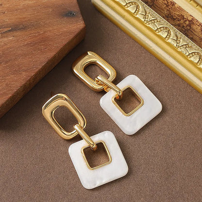 Hollow geometric square earrings with chamfered corners and electroplated copper finish