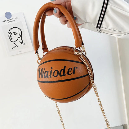 Basketball-shaped handbag with adjustable shoulder strap in pink, white, black, and brown