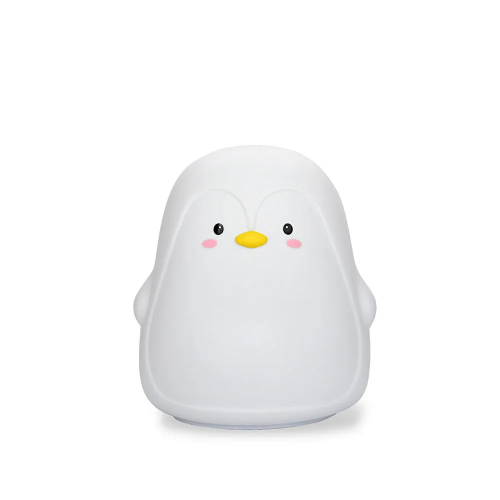 White silicone penguin-shaped USB rechargeable night light on a surface.