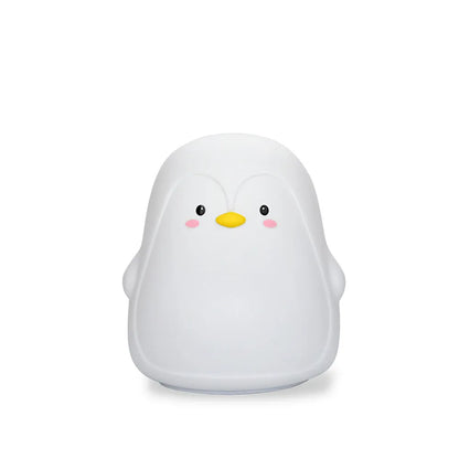 White silicone penguin-shaped USB rechargeable night light on a surface.