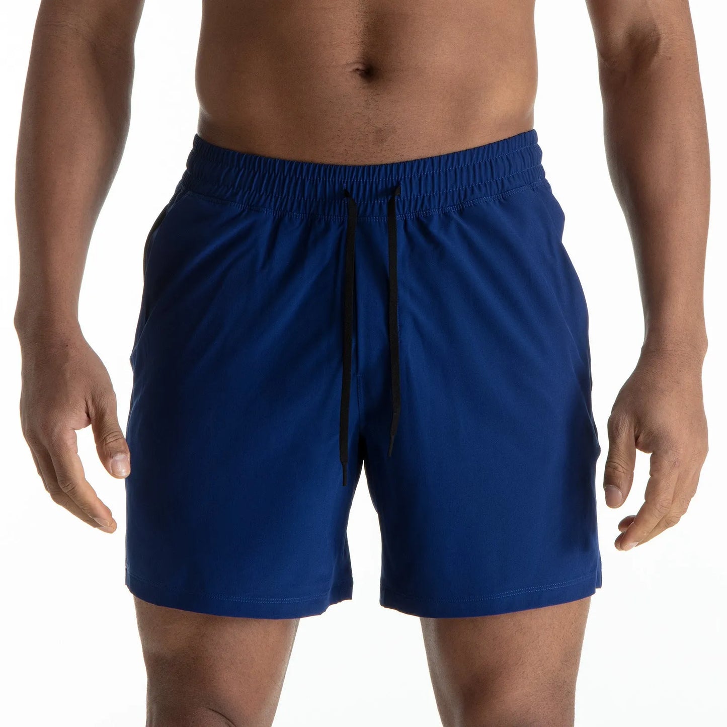 Man wearing black quick-dry polyester sports shorts suitable for running or gym workouts.