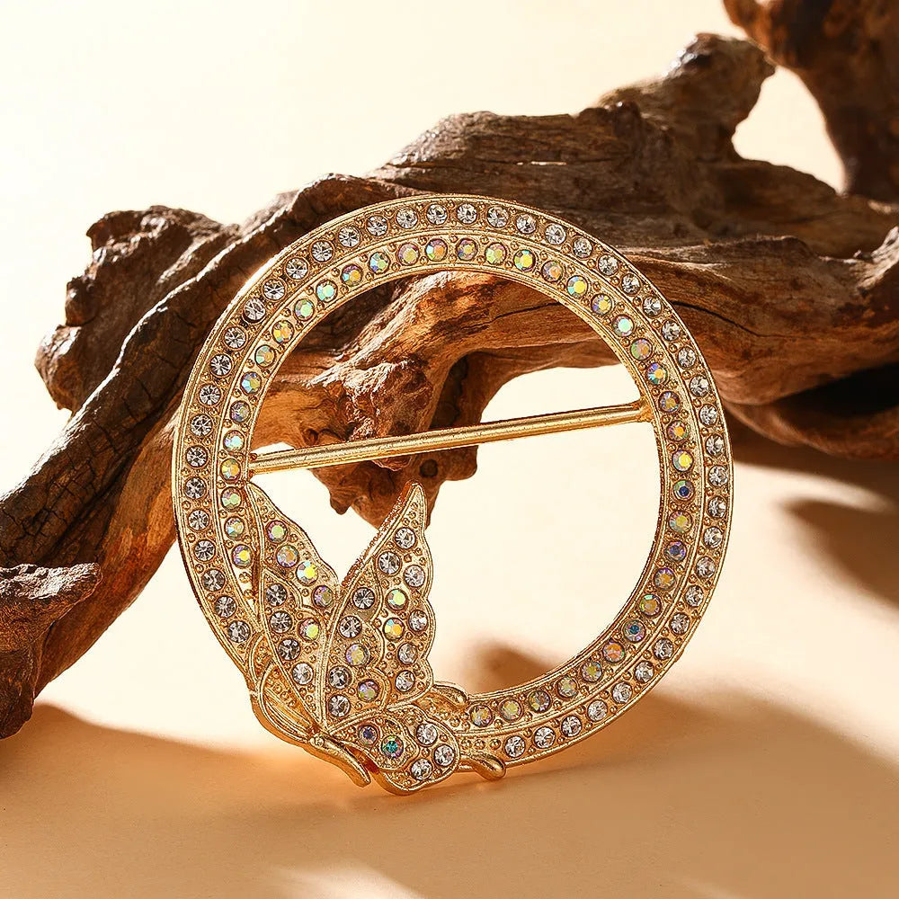 Bow-shaped waist-cinching accessory clip for high-end brooches, alloy with electroplating and diamond inlay, shown in gold, silver, or rose gold finishes.