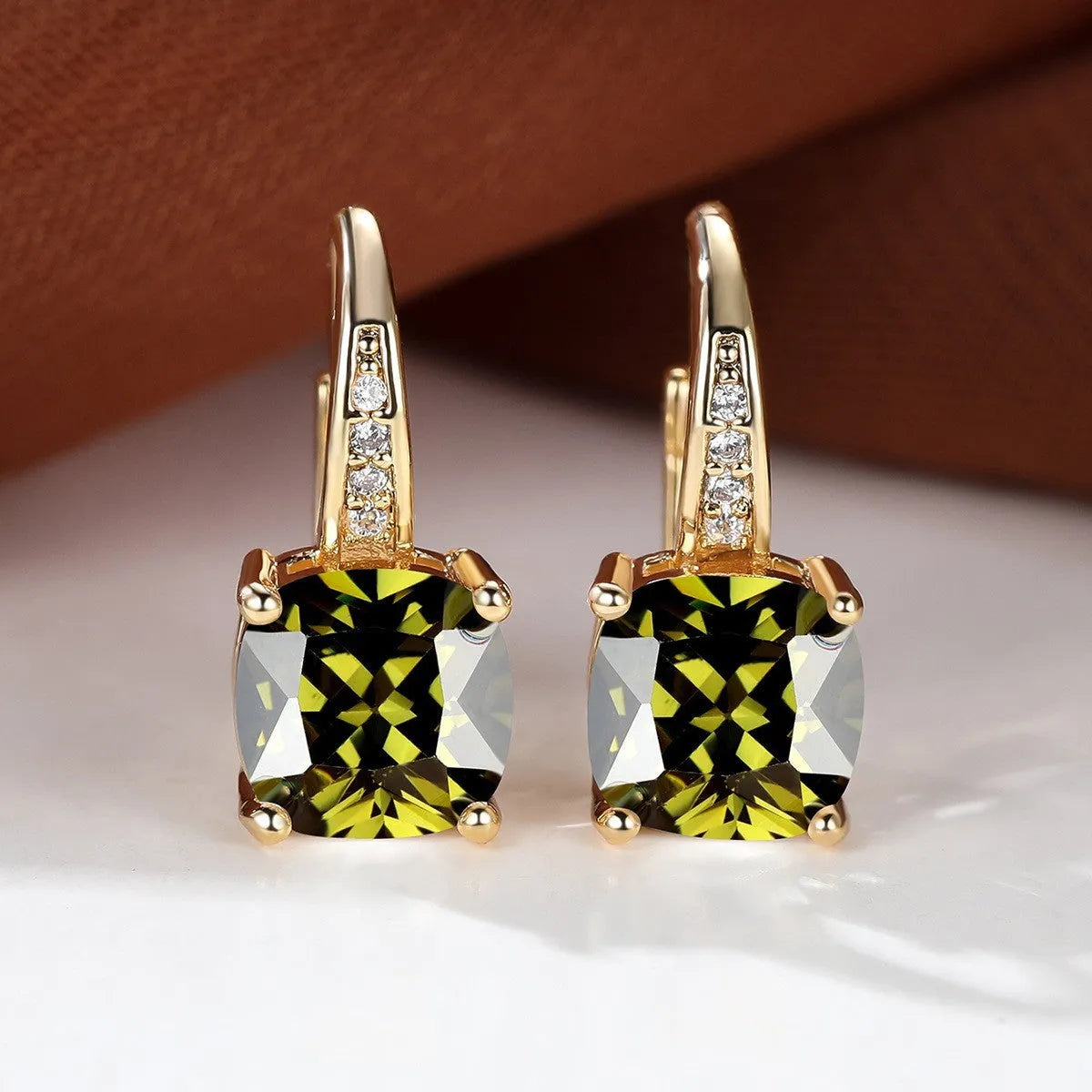 Square zircon inlaid ear hook earrings with geometric design and electroplated finish in golden tone
