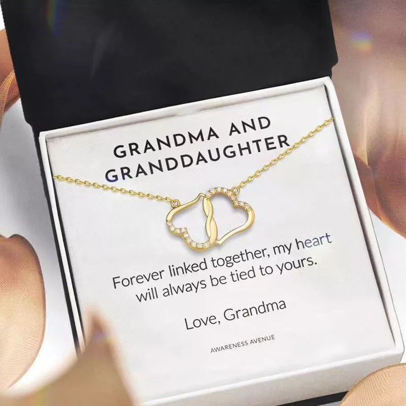 Double Heart Love Necklace with rhinestones and zircon inlay on a model