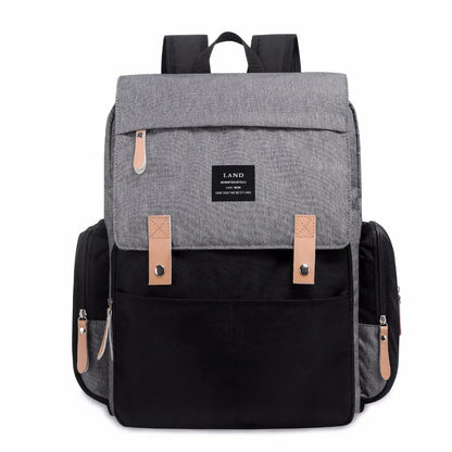 LAND Mommy large grey diaper backpack with changing mat, shown as a travel nappy bag.