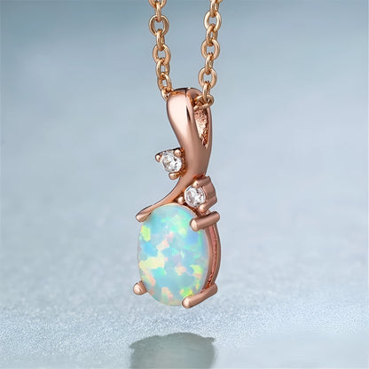 Water drop shaped opal pendant on an adjustable O-chain necklace in rose gold finish.