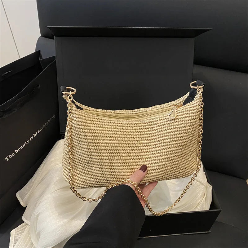 Woven straw shoulder tote bag in a horizontal square shape with a sandwich pocket.