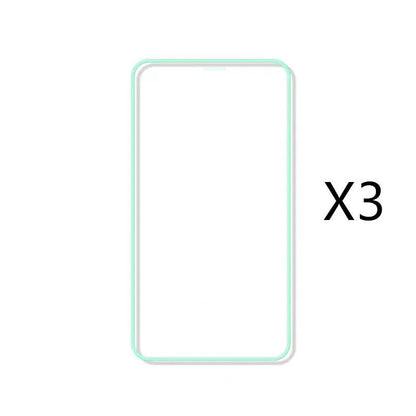 Luminous tempered glass screen protector glowing in dark next to iPhone