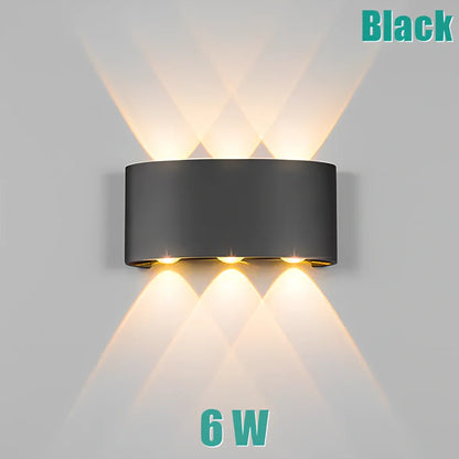 Waterproof black aluminium LED wall lamp 4W warm white emitting 60-degree beam angle mounted on white wall