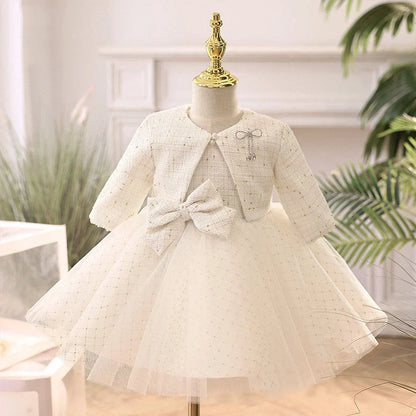 White long-sleeved flower girl wedding dress with princess styling on mannequin
