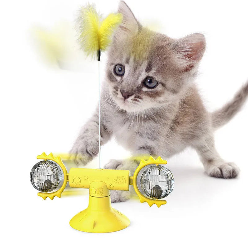 Cat rotating windmill toy with suction base, two transparent bins, blue and yellow-green TPR body.
