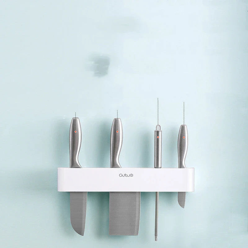 Sleek wall-mounted knife organizer with slots for knives and hooks for storing kitchen essentials