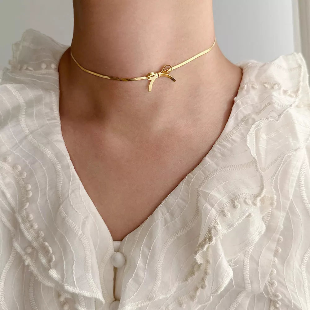 Trendy bowknot stainless steel gold plated snake chain necklace for women