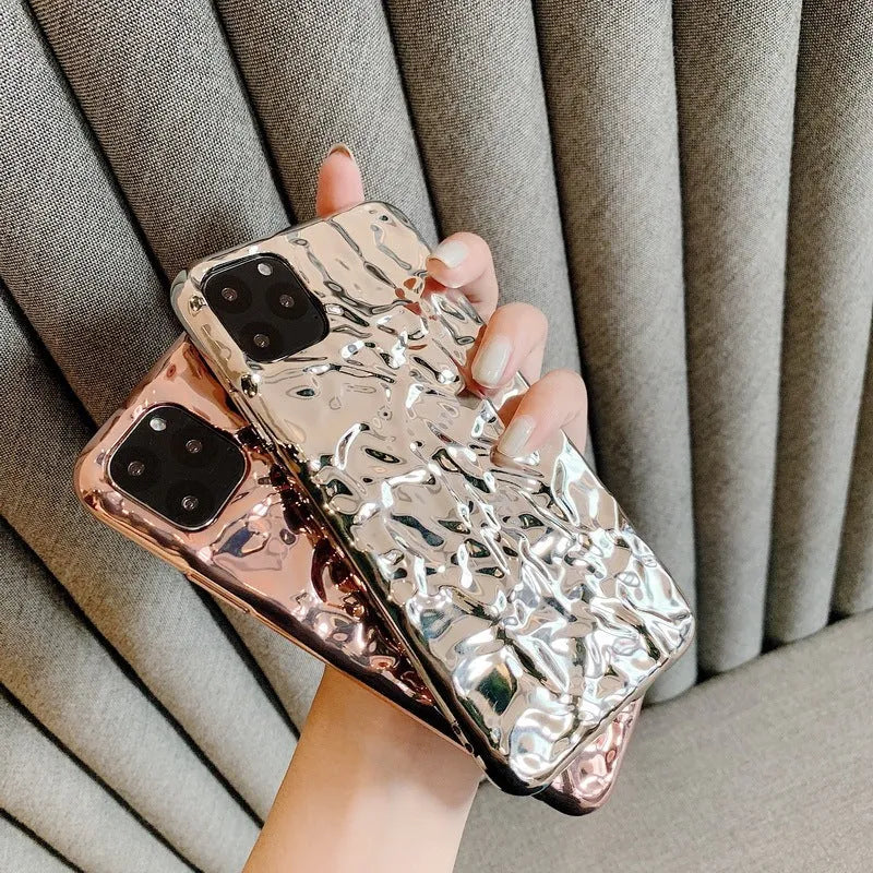 Rose gold electroplated TPU back cover case for iPhone on a table.