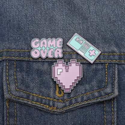 Stereo game console badge made from alloy metal in three colour options for bag mounting.