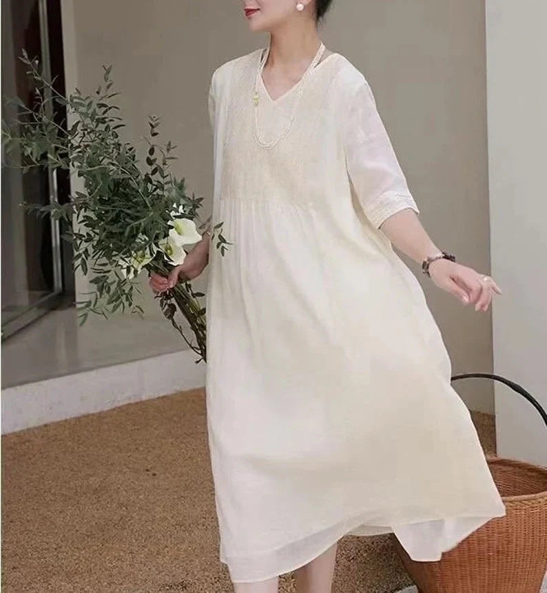 Women's white linen dress for summer, showcasing breathable and lightweight design