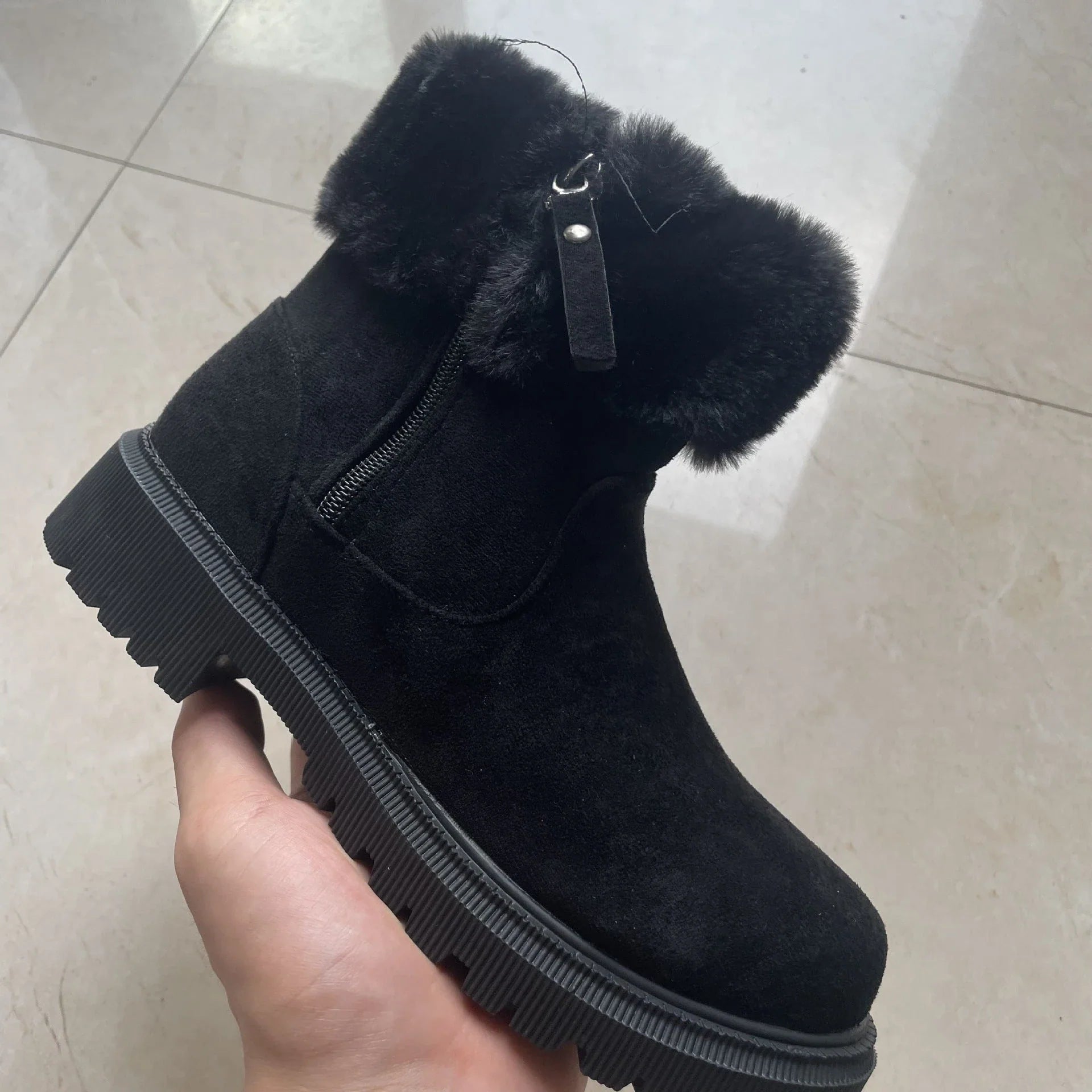 Cozy plush winter boots with side zipper closure, rubber sole, and suede upper in beige and black colors