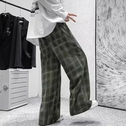 Men's black and green plaid straight leg trousers showing mid-waist design and six size options
