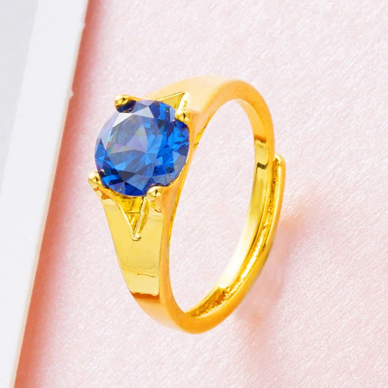 Women's adjustable copper ring with Vietnam placer gold zircon stones in six colour options showing adjustable opening mechanism