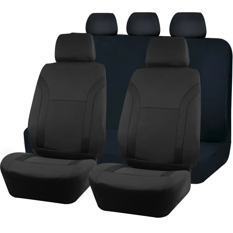 Polyester car seat cover set with eyelet stitching and sponge inserts in black, laid out on a car seat.