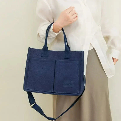 Premium canvas tote bag in multiple colors with adjustable shoulder strap and organizational pockets