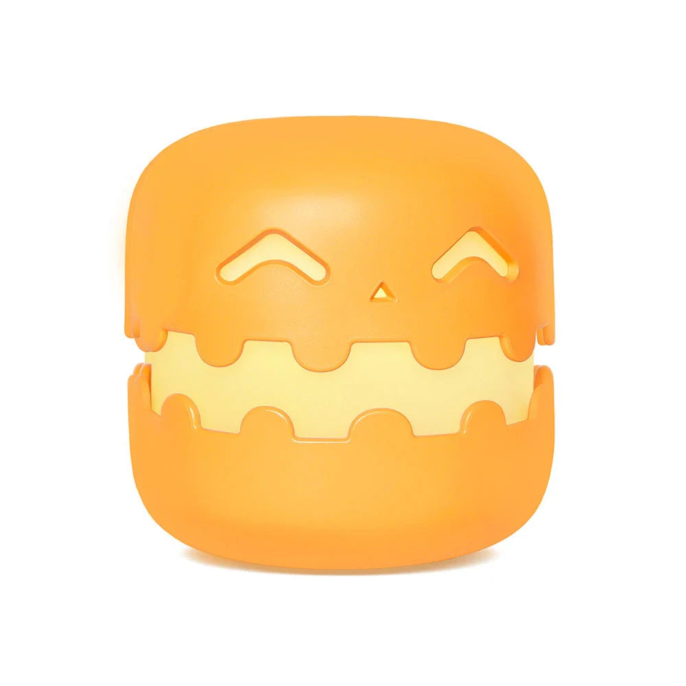 Pumpkin-shaped nightlight with soft silicone construction and warm, soothing glow for creating a cozy Halloween atmosphere
