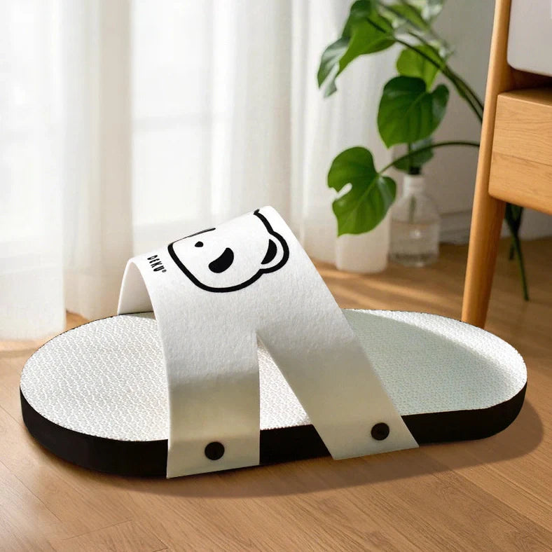 White slipper style cat scratch board made from corrugated paper measuring 30cm length