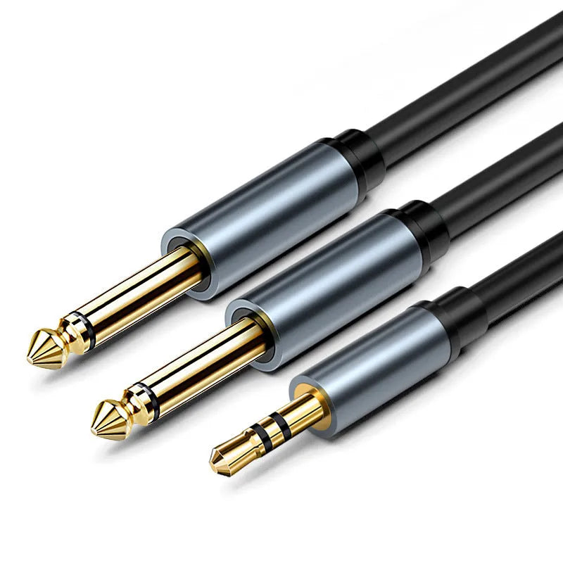 A 3.5mm stereo jack to two 6.5mm mono jack audio cable on a grey background.