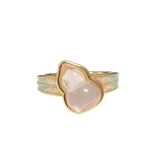 Adjustable copper gourd ring with zircon stones showing flower and bow design elements