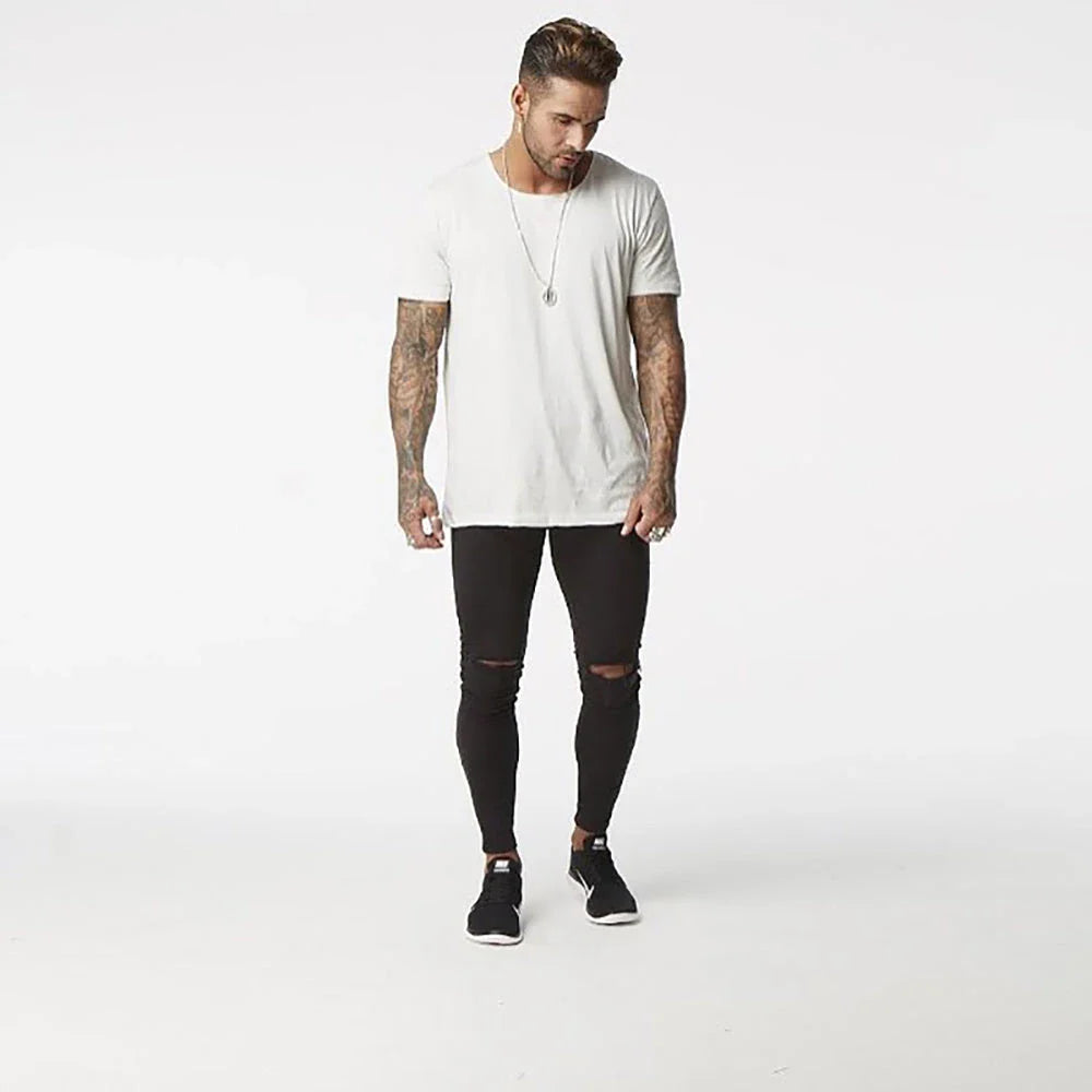 Premium Distressed Men's Skinny Jeans in Black, featuring a skinny silhouette and trendy distressed details for a casual cool style.