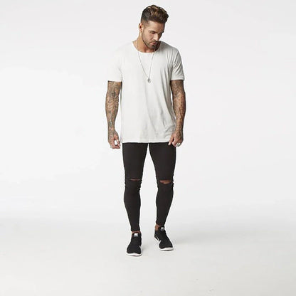 Premium Distressed Men's Skinny Jeans in Black, featuring a skinny silhouette and trendy distressed details for a casual cool style.