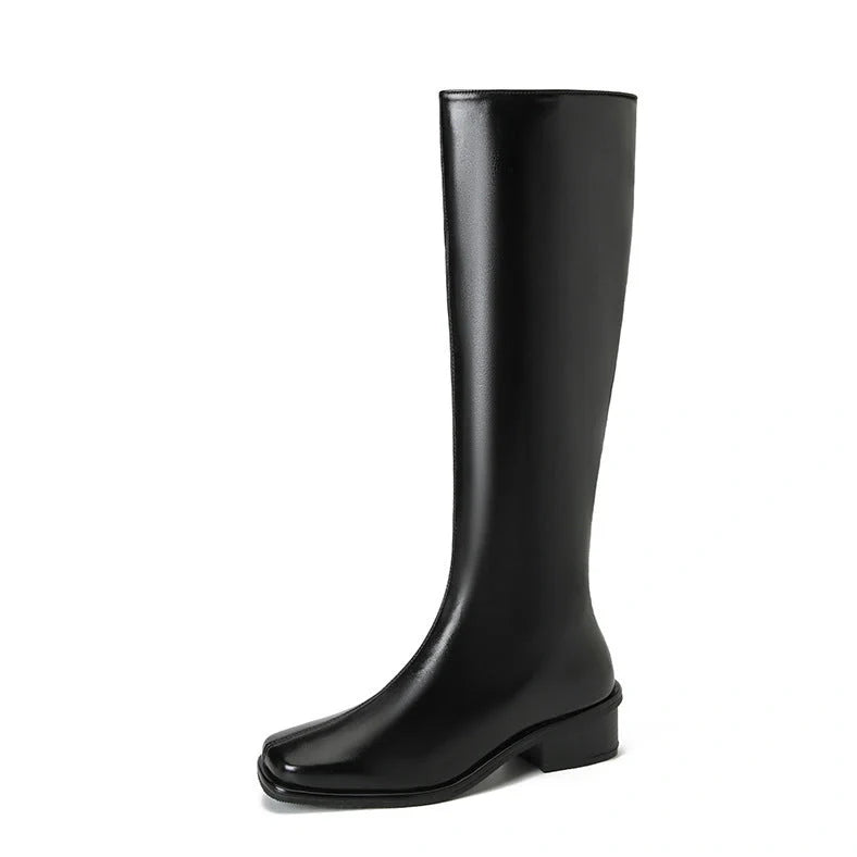 Black square toe over-the-knee boots with 4cm chunky heel showing leather interior and rubber sole