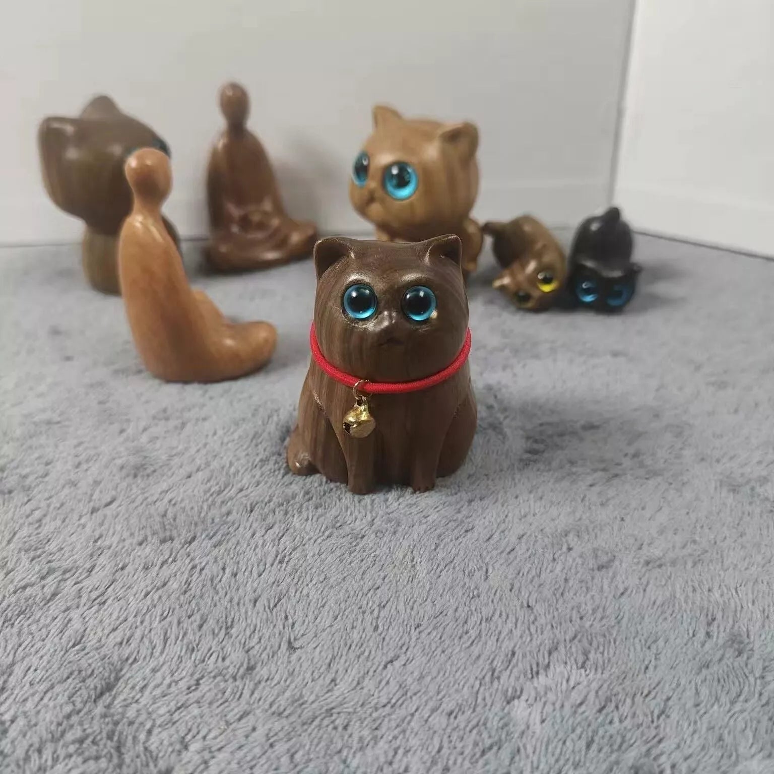 Handmade green sandalwood kitten ornament with unique design