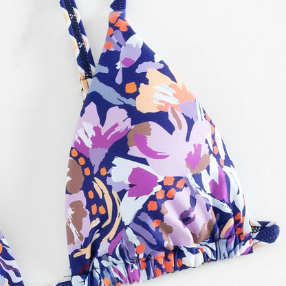 Women's floral print polyester swimsuit briefs with triangle bag design in available sizes