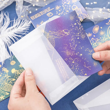 Set of three bronzing detail greeting card envelopes in cosmic colours, showing mermaid style fold.