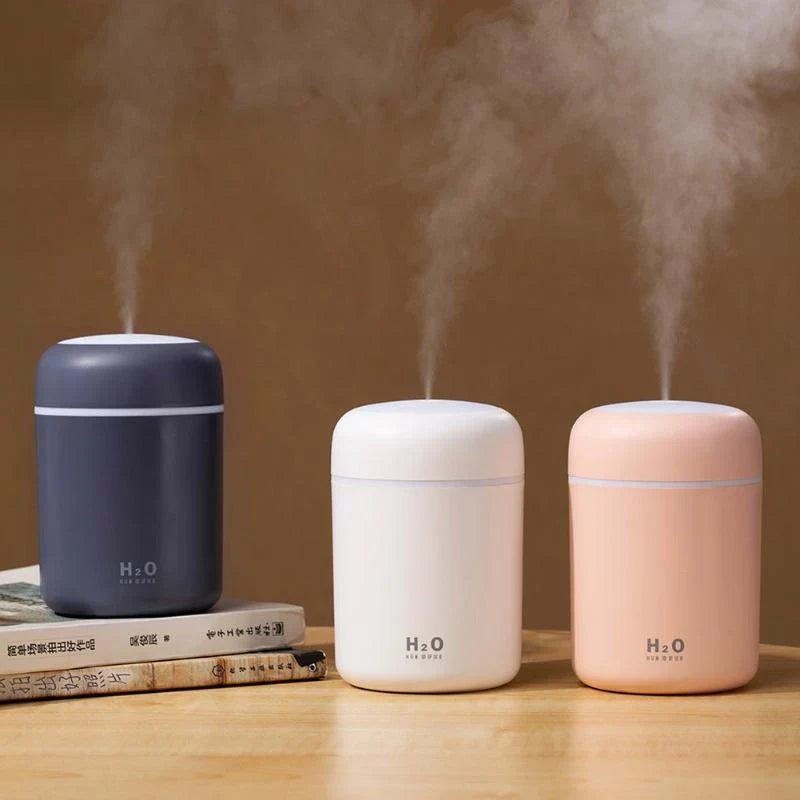 Compact and Quiet Bedroom Mist Humidifier with Soothing Mood Lighting in White, Navy Blue, and Pink Colors